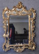 A carved giltwood Chinese Chippendale style pier mirror the central plate flanked by glazed