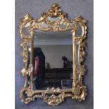 A carved giltwood Chinese Chippendale style pier mirror the central plate flanked by glazed