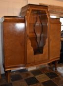 A Continental Art Deco burr walnut display cabinet fitted central astragal glazed section flanked by