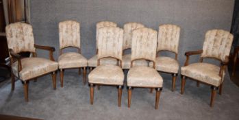 A set of eight Continental Art Deco bird's eye walnut dining chairs in floral damask upholstery on