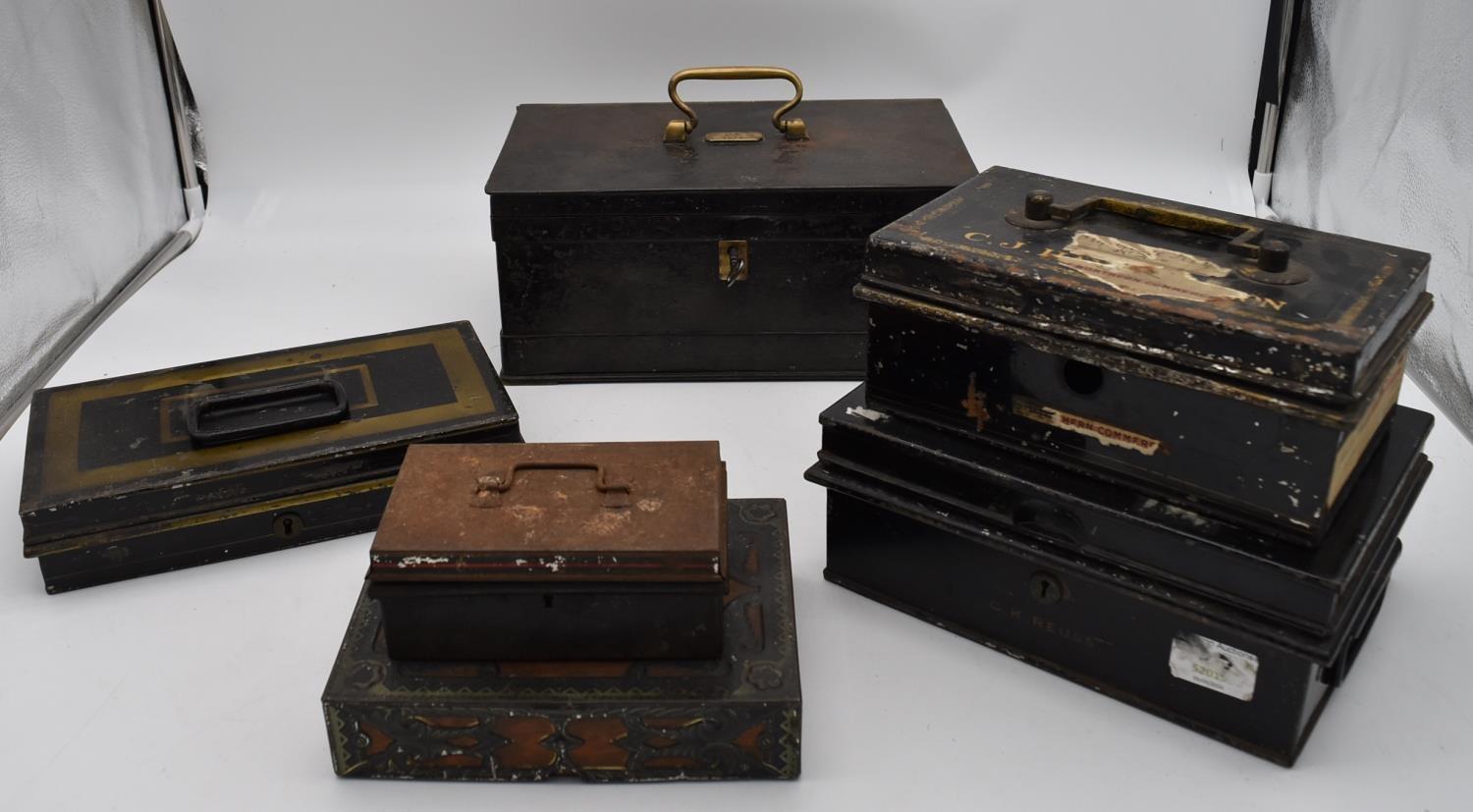 A 19th century heavy metal strong box with brass carrying handle and key and a collection of five