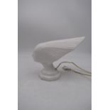 A vintage style white ceramic lamp in the form of the Spirit of the Wind. H.24x30cm