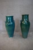 A pair of turquoise glazed Sharab wine vessels. H.78x24cm