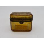 A small 19th century engraved amber glass and ormolu mounted box. H.7x8cm
