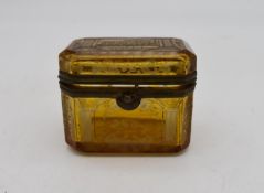 A small 19th century engraved amber glass and ormolu mounted box. H.7x8cm