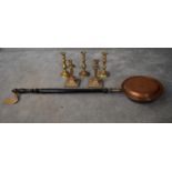 A pair of brass candlesticks, three others and a copper warming pan. H.22cm (candlesticks) H.