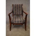 A Continental elm framed Empire style armchair. H.90x55cm
