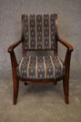 A Continental elm framed Empire style armchair. H.90x55cm
