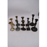 A pair of Art Nouveau inspired candlesticks and various other silver plated candlesticks. H.23cm (