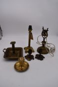 Two vintage brass lamp bases and various other brass candlesticks. H.28cm