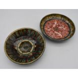 Two Persian antique hand painted glazed dishes. One with a geometric sunburst design, the other