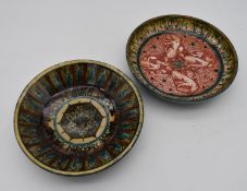 Two Persian antique hand painted glazed dishes. One with a geometric sunburst design, the other