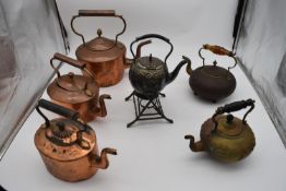 A 19th century silver plated spirit kettle on stand and a collection of five copper and brass
