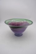 An art glass purple and green swirl bowl by Australian artist Tricia Allen. H.17x32cm