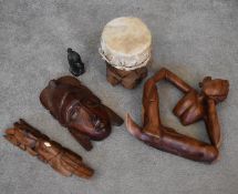 A small carved green hardstone African bust and a collection of various African tribal wooden