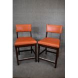 A pair of leather upholstered teak framed high stools. H.100x55cm