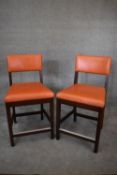 A pair of leather upholstered teak framed high stools. H.100x55cm