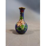 A Chinese Cloisonné enamel vase with peony and butterfly motifs and a cloud form background. H10cm.