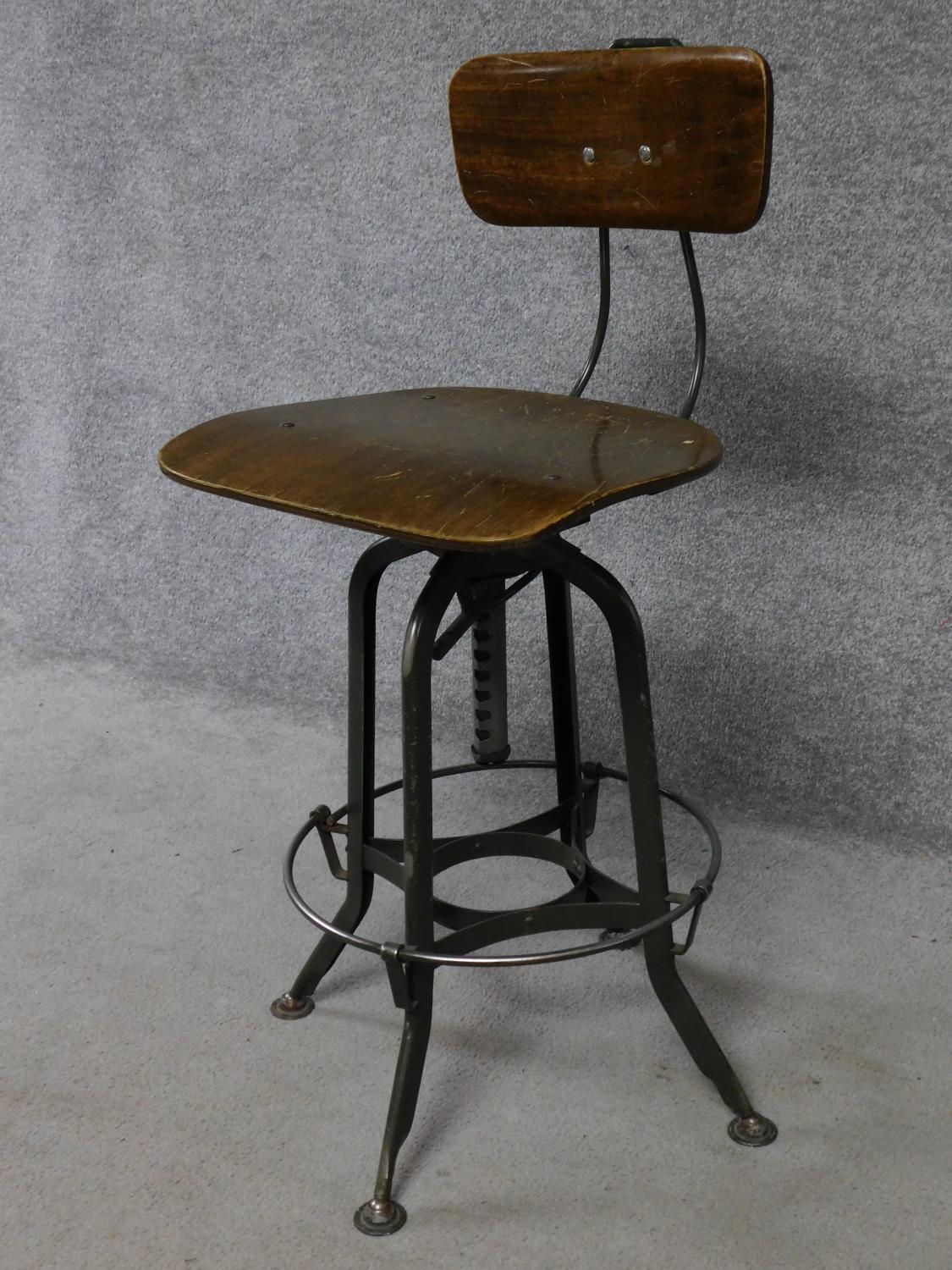 A mid 20th century industrial style metal framed machinist's chair with laminated seat and back. H. - Image 2 of 5