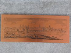 A vintage copper plate engraving of the German city of Aschaffenburg mounted on a wooden board.