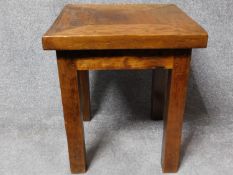 A Eastern hardwood side table on square supports. H.60 W.50 D.50cm