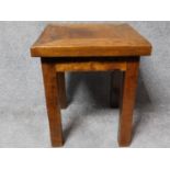 A Eastern hardwood side table on square supports. H.60 W.50 D.50cm