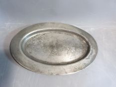 An antique oval pewter platter, circa 1800. Stamped for James Yates Pewter, Birmingham, England.