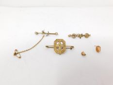 A collection of yellow metal and silver brooches, including a yellow metal and white metal bar