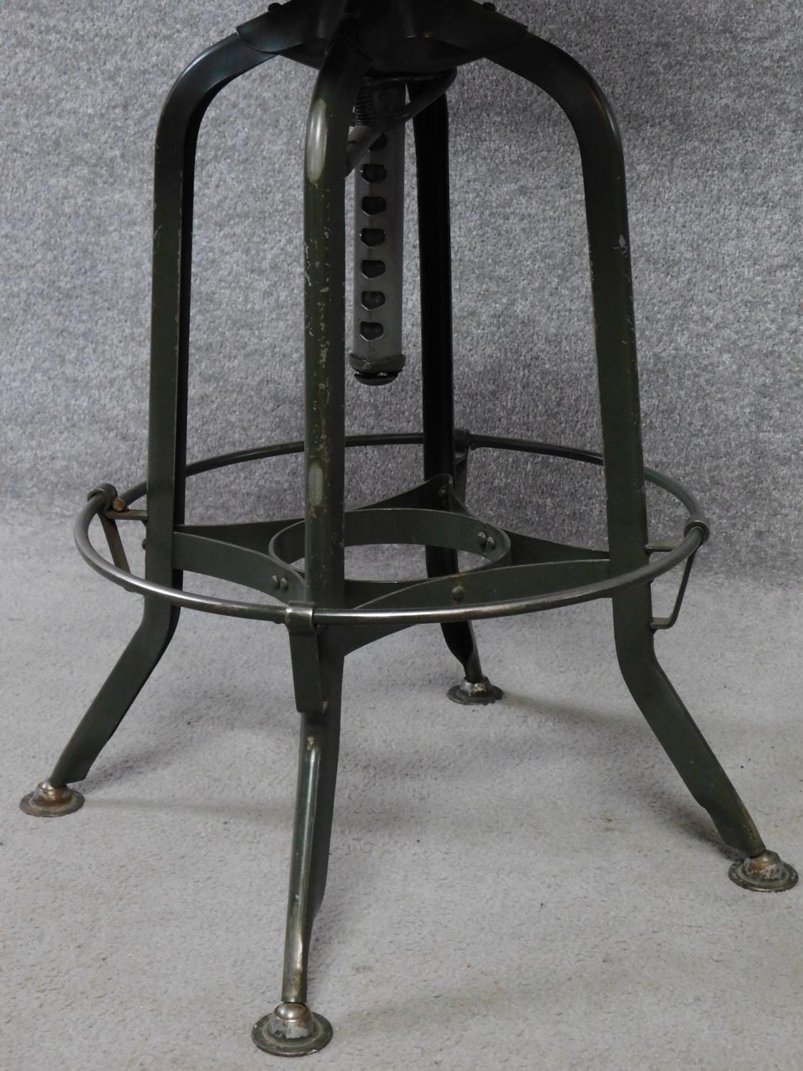 A mid 20th century industrial style metal framed machinist's chair with laminated seat and back. H. - Image 4 of 5