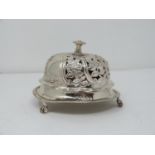 A Victorian silver pierced desk bell with stylised floral design and stylised four petal flower to