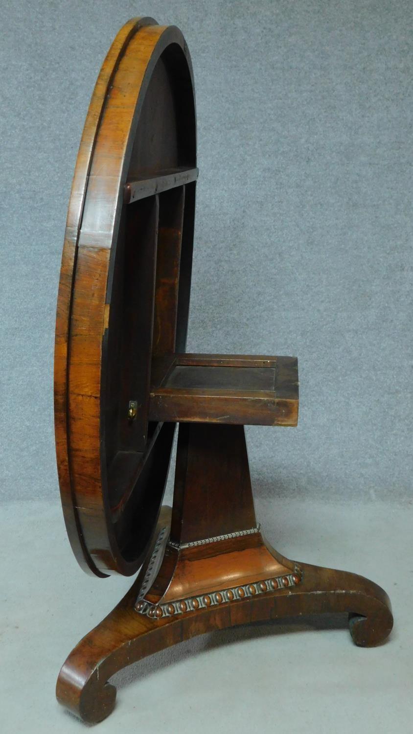 A Regency rosewood circular tilt top loo table on pedestal tripod base. H.73 L.123 W.123cm - Image 3 of 7