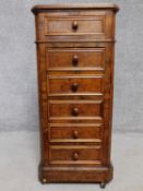 A 19th century Continental burr walnut marble topped bedside chest of four drawers with hinged