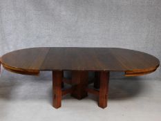 An American Arts and Crafts Mission style oak extending table with four extra leaves. H.72 W.249 D.