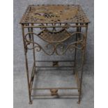 A wrought iron conservatory occasional table on stretchered supports. H.63 W.38 D.38cm