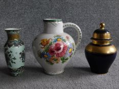 A Ulmer Keramie West German hand painted jug with floral design, makers mark to base, a Rosenthal