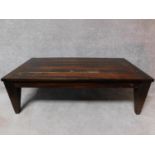 An Eastern teak coffee table on square tapering supports. H.45 L.140 W.70cm