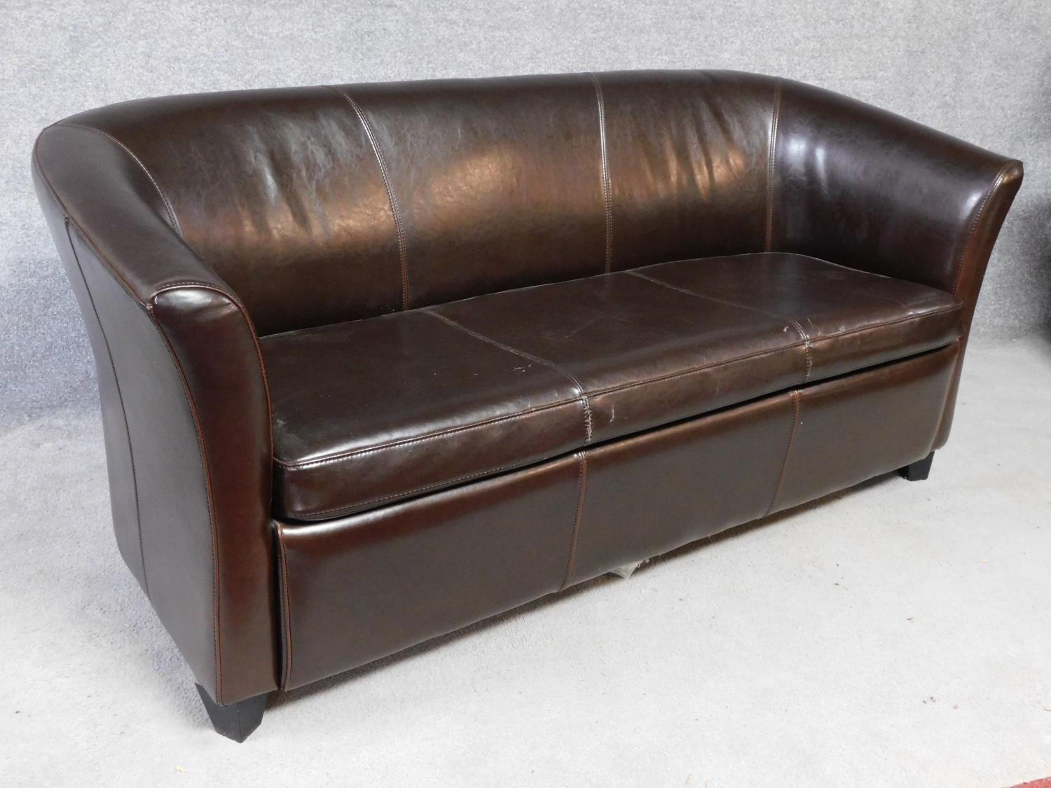 A tan leather two seater tub shaped sofa. H.78 W.173 D.83cm - Image 2 of 4