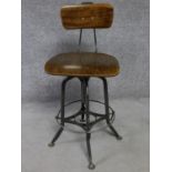 A mid 20th century industrial style metal framed machinist's chair with laminated seat and back. H.
