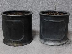 A pair of resin faux lead planters with central panels. H.25 W.27 D.27cm