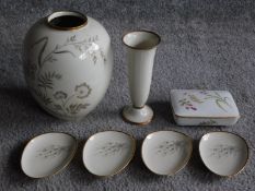 A set of four porcelain Tirschenreuth pebble shaped dishes with with gilded foliate design, a Johann