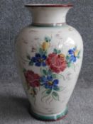 A vintage German ceramic vase with hand painted floral design. Stamled 47340, Germany to the base.