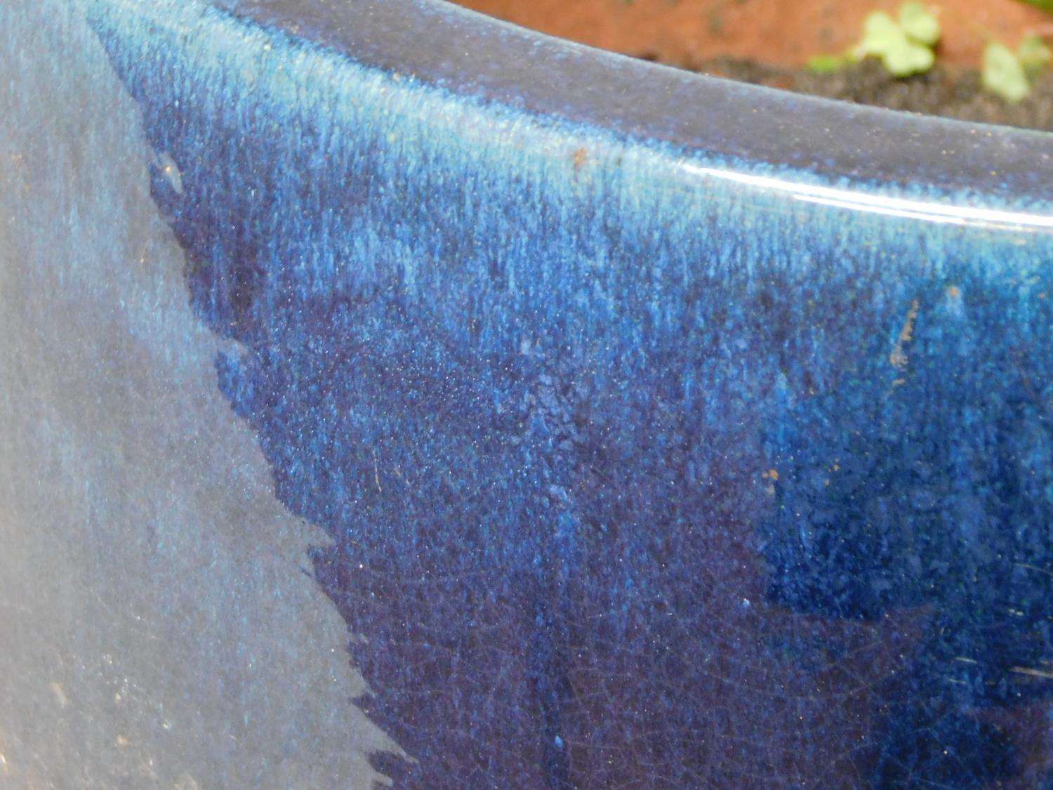 A blue glazed cylindrical garden planter. H.43 W.47 D.47cm - Image 3 of 3
