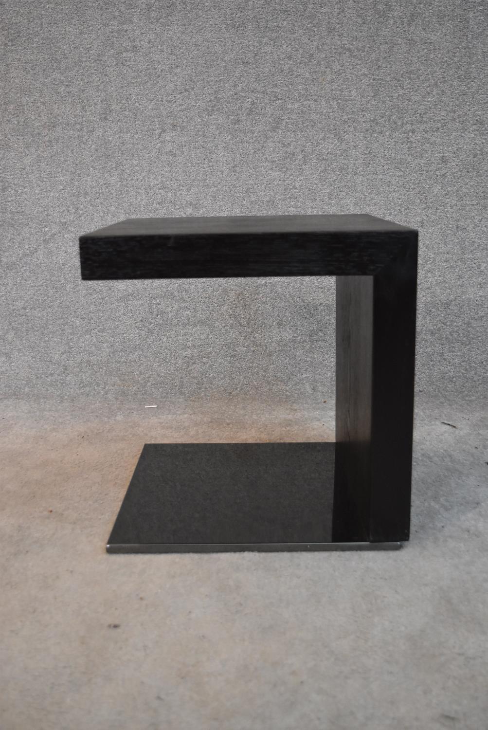 A contemporary ebonised cubiform occasional table. H.42x40cm