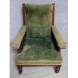 A late Victorian mahogany velvet upholstered armchair raised on turned tapering supports. H.94cm