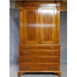 A Georgian style yew and walnut crossbanded armoire with panel doors above four graduating drawers