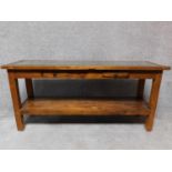 An Eastern hardwood console table with two frieze drawers on square supports united by undertier.