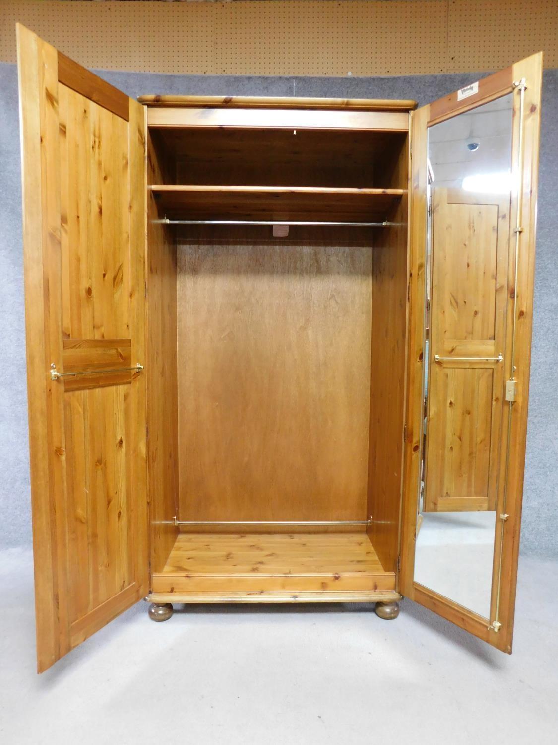 A contemporary pine wardrobe with mirror to interior of panel door. By English maker Victoria. H.183 - Image 3 of 6