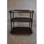 A vintage elm Ercol drinks trolley with three tiers on casters. H.77 x W.72cm