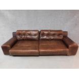 A vintage style brown leather button back two seater sofa retailed by Habitat. H.65 W.236 D.90cm