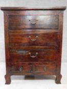 An Eastern hardwood chest with an arrangement of five drawers on cabriole supports. H.113 W.87 D.